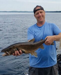 Maine fishing guide, Charles McGee, sporting a big lake catch in southern Maine.